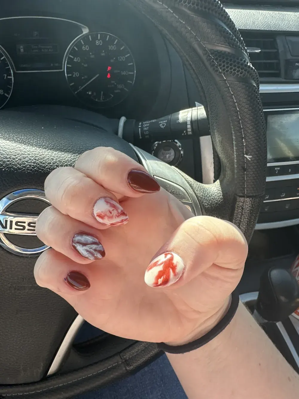 Deep cherry set with red and white marble and splatter accent nails